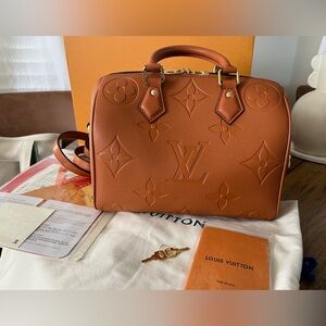 Louis Vuitton Speedy 25 Bandouliere Empreinte Monogrammed Bag